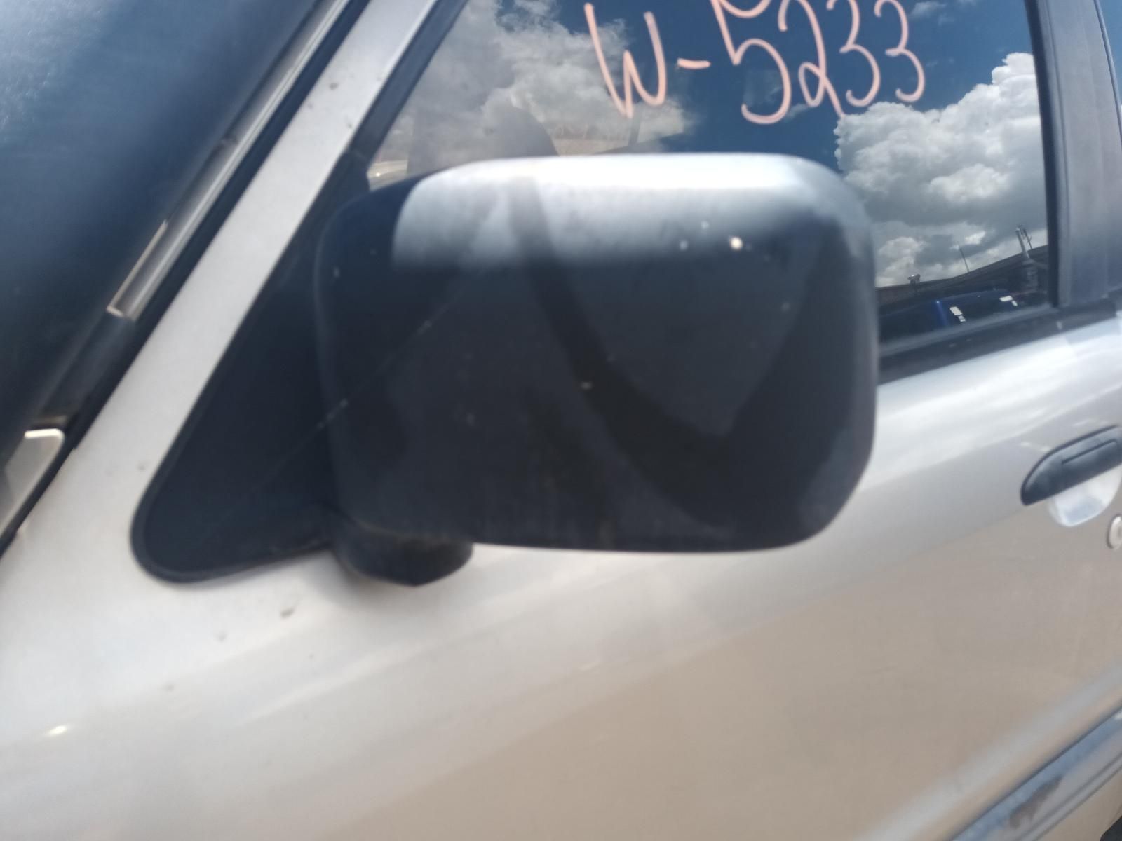 A White Car with the Number W-5333 on the Side — South West 4WD Wreckers In Brisbane, QLD