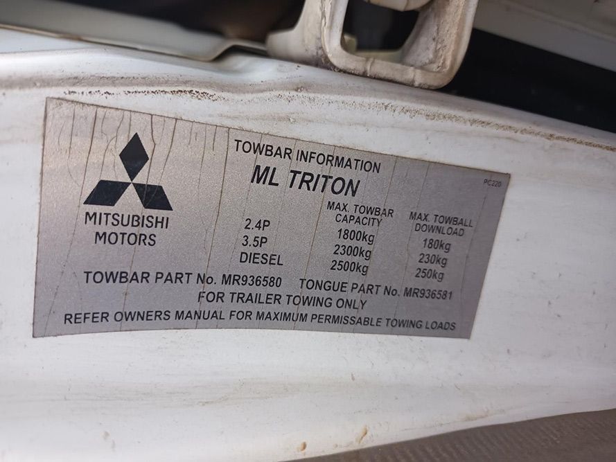 A Close Up of a Mitsubishi Motors Towbar Information Label — South West 4WD Wreckers In Brisbane, QLD