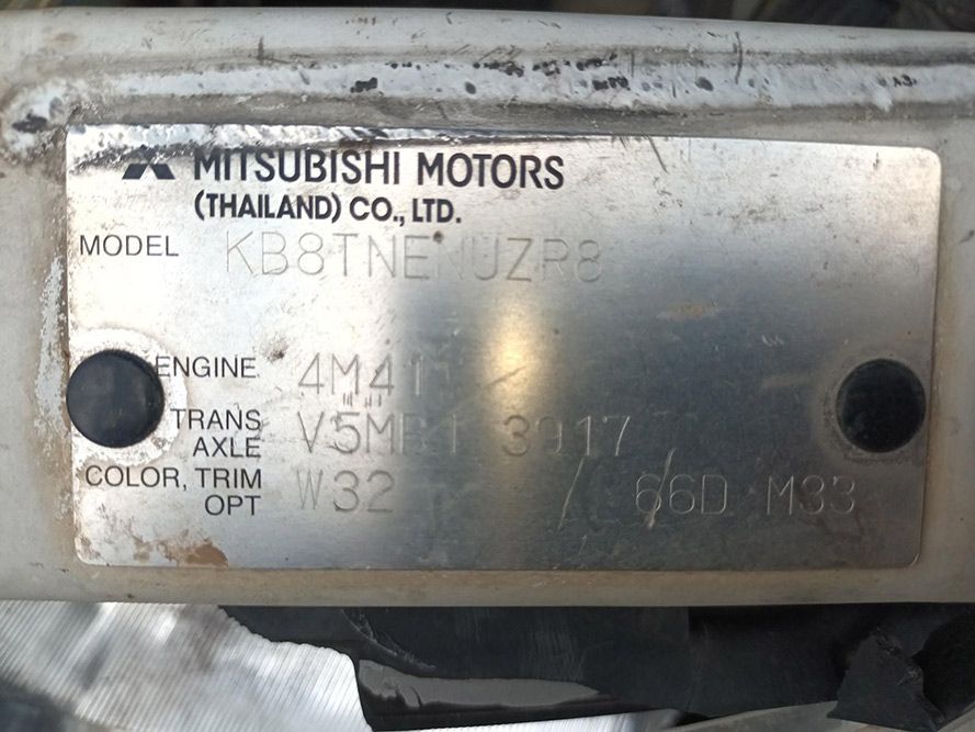 A Close Up of a Mitsubishi Motors Plate — South West 4WD Wreckers In Brisbane, QLD