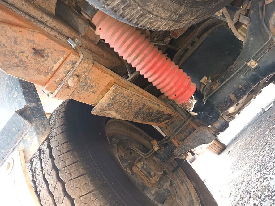 A Close Up of the Underside of a Truck With a Red Shock Absorber — South West 4WD Wreckers In Brisbane, QLD