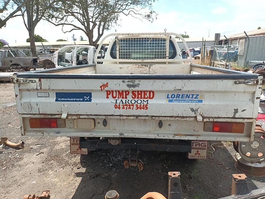 A White Truck With Pump Shed Written on the Back — South West 4WD Wreckers In Brisbane, QLD