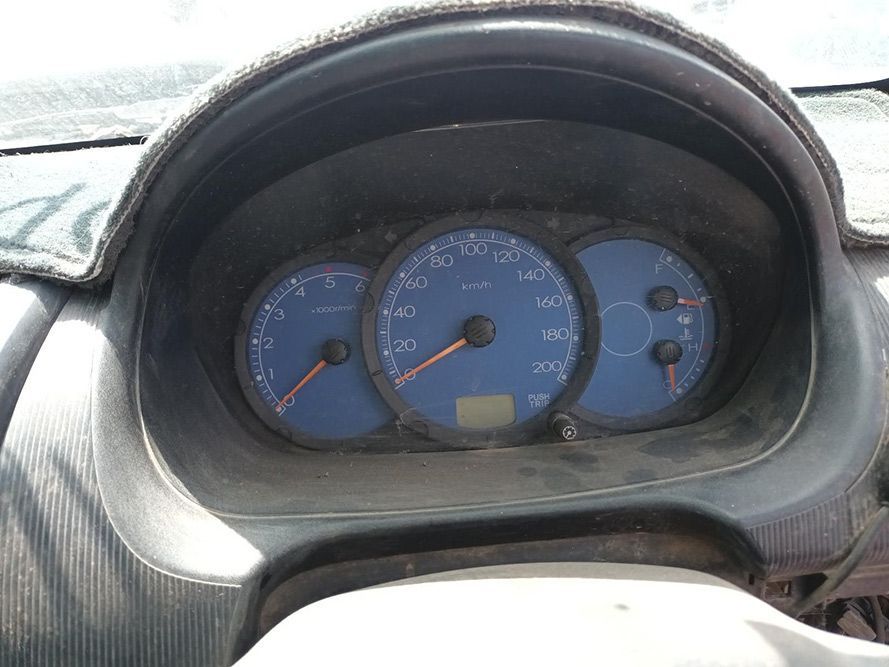A Close Up of a Car Dashboard With a Blue Speedometer — South West 4WD Wreckers In Brisbane, QLD