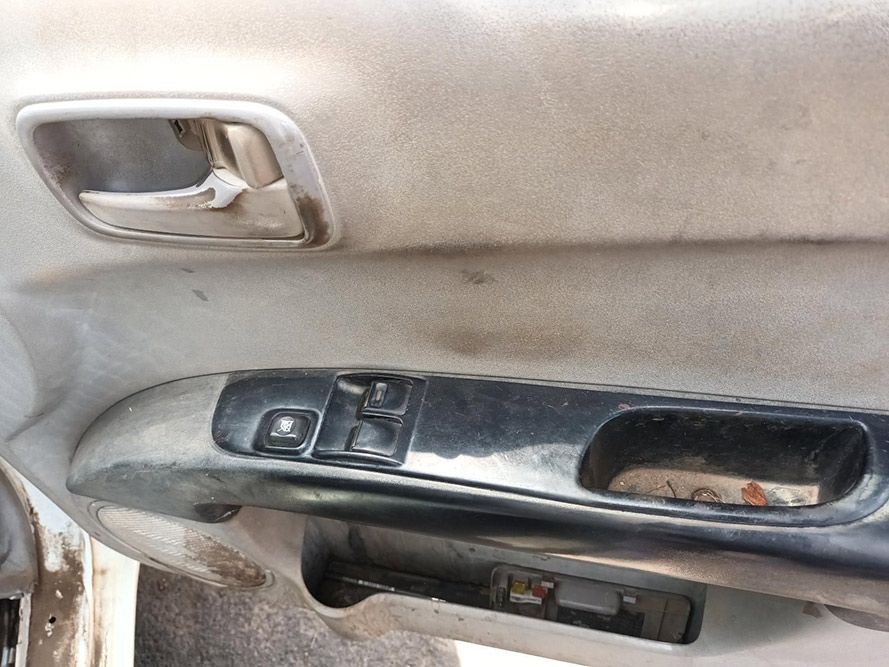 A Close Up of a Car Door With a Handle and a Window Switch — South West 4WD Wreckers In Brisbane, QLD