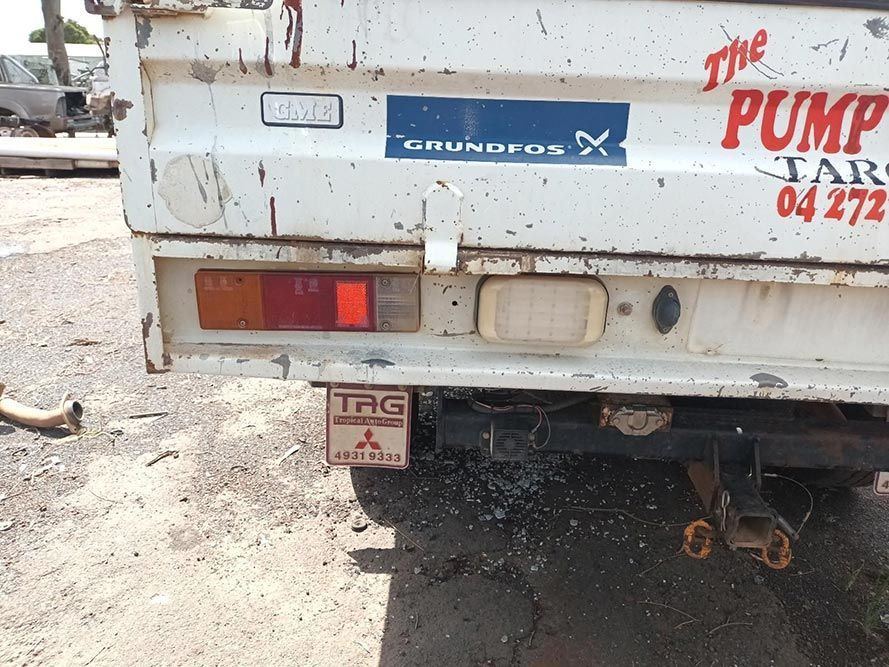 The Back of a White Truck That Says the Pump Tarp 04 272 — South West 4WD Wreckers In Brisbane, QLD