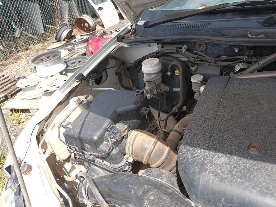 The Engine of a Car is Visible Under the Hood— South West 4WD Wreckers In Brisbane, QLD