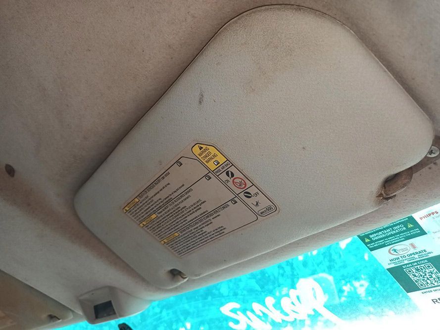 A Sun Visor is Hanging From the Ceiling of a Car — South West 4WD Wreckers In Brisbane, QLD