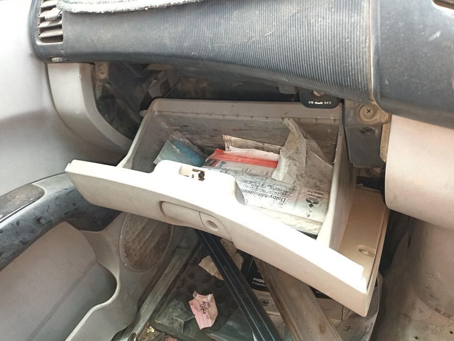 A Dirty Glove Box in a Car With Papers in It — South West 4WD Wreckers In Brisbane, QLD