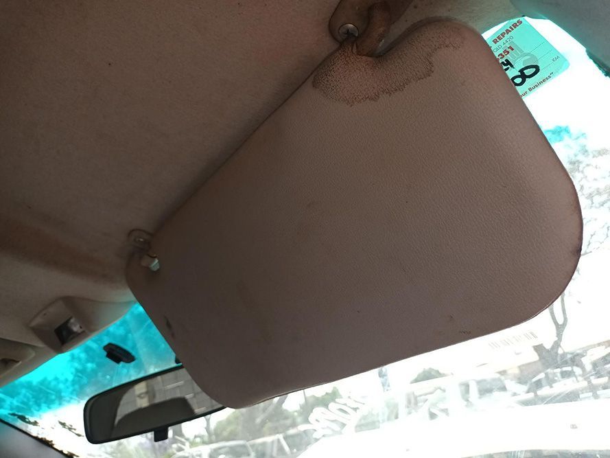 A Sun Visor is Hanging From the Ceiling of a Car — South West 4WD Wreckers In Brisbane, QLD