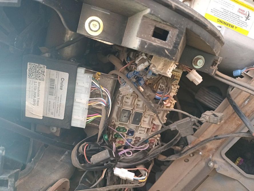 A Bunch of Wires Are Coming Out of the Hood of a Car — South West 4WD Wreckers In Brisbane, QLD