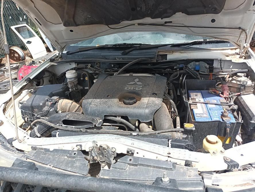 The Engine of a Car is Visible Under the Hood — South West 4WD Wreckers In Brisbane, QLD