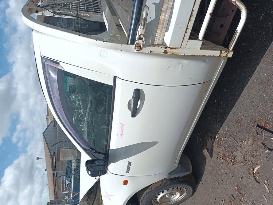 A White Truck is Parked on the Side of the Road — South West 4WD Wreckers In Brisbane, QLD