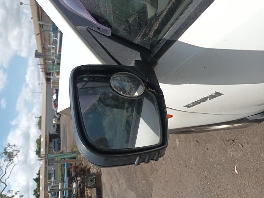 A Close Up of a Side View Mirror on a White Car — South West 4WD Wreckers In Brisbane, QLD