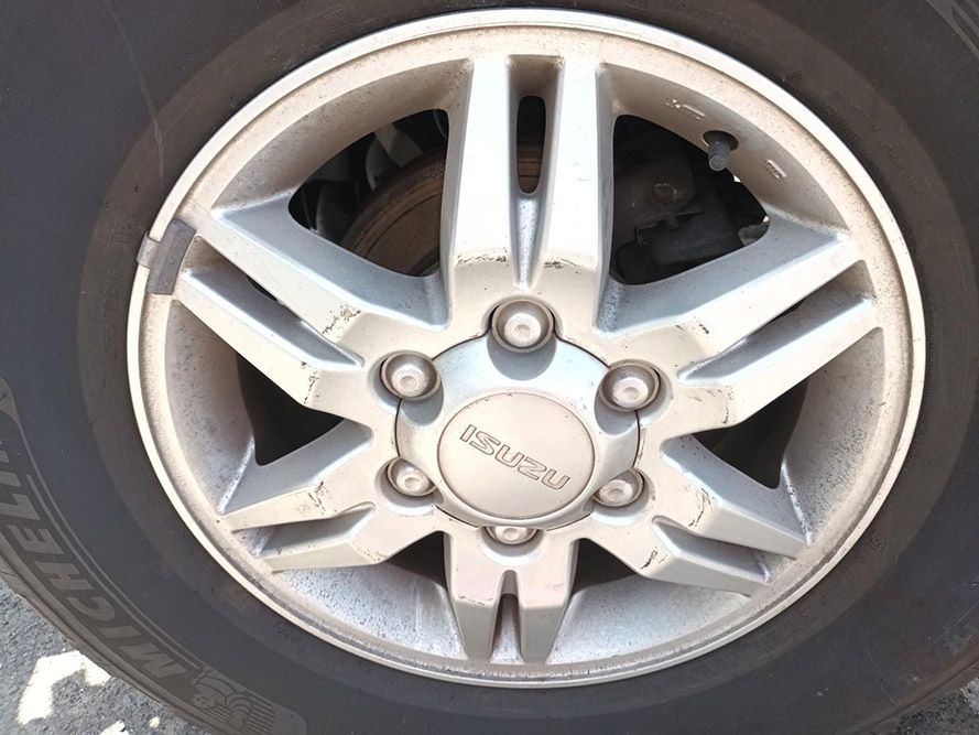 A Close Up of a Car Wheel That Says Isuzu on It — South West 4WD Wreckers In Harristown, QLD