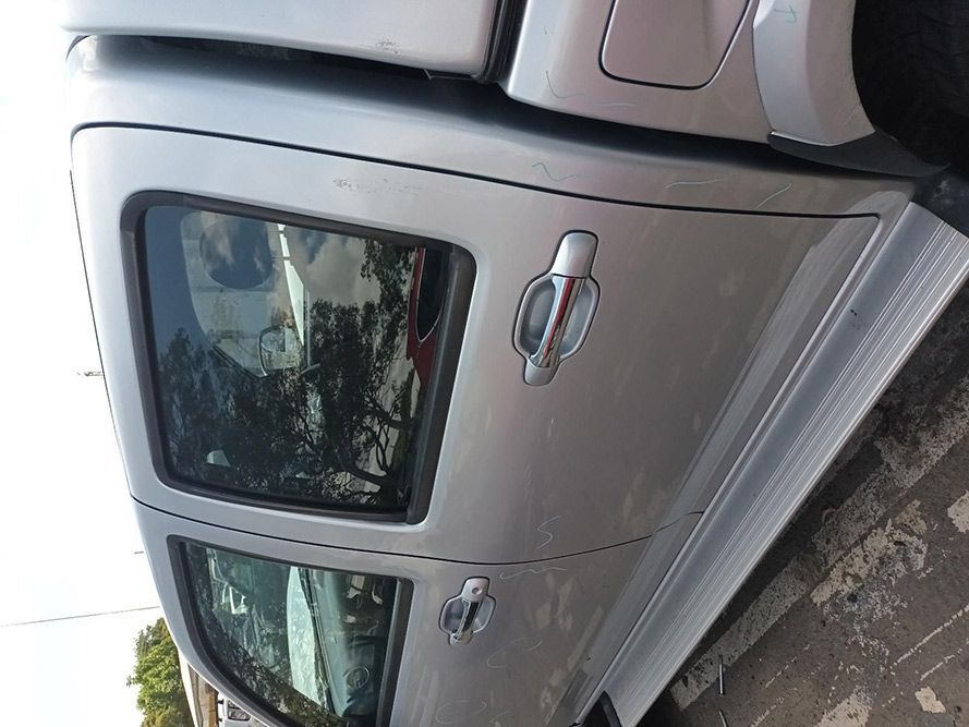 A Silver Car is Parked on the Side of the Road — South West 4WD Wreckers In Harristown, QLD