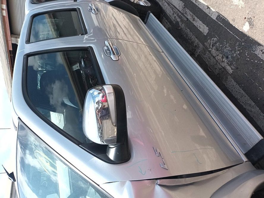 A Silver Truck is Parked on the Side of the Road — South West 4WD Wreckers In Harristown, QLD