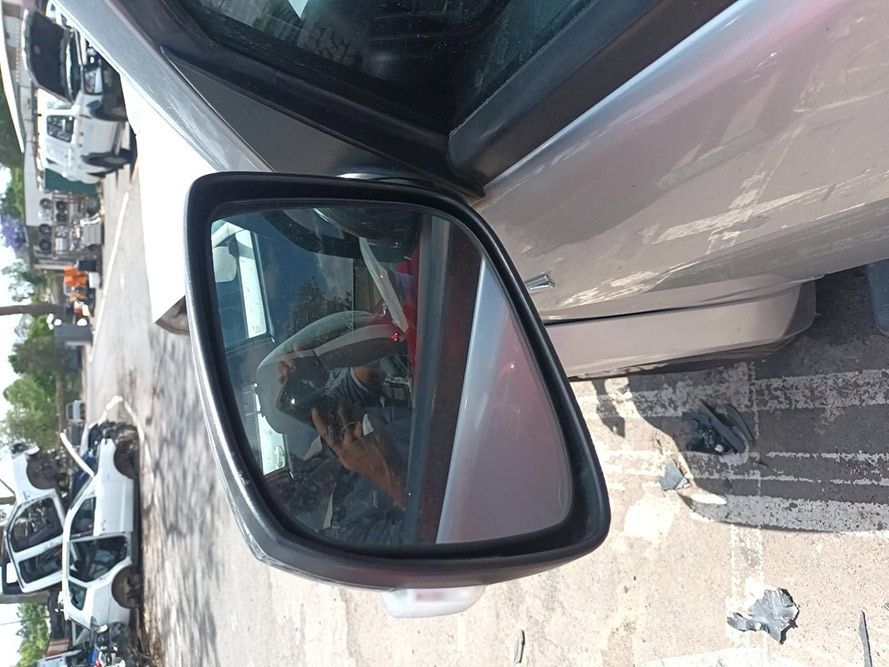 A Close Up of a Car 's Side View Mirror in a Parking Lot — South West 4WD Wreckers In Harristown, QLD