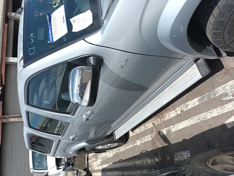 A Silver Truck is Parked in a Parking Lot — South West 4WD Wreckers In Harristown, QLD