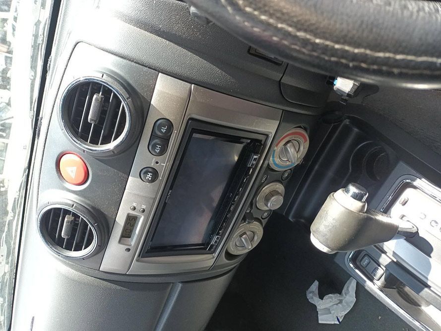 A Close Up of a Car Dashboard With a Radio and Air Vents — South West 4WD Wreckers In Harristown, QLD