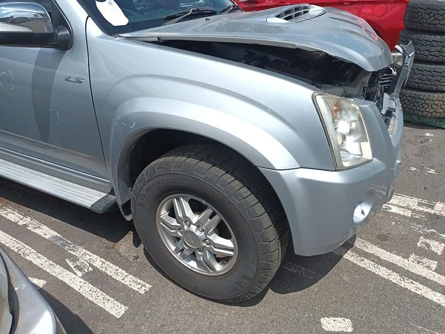 A Silver Truck With the Hood Open is Parked in a Parking Lot — South West 4WD Wreckers In Harristown, QLD