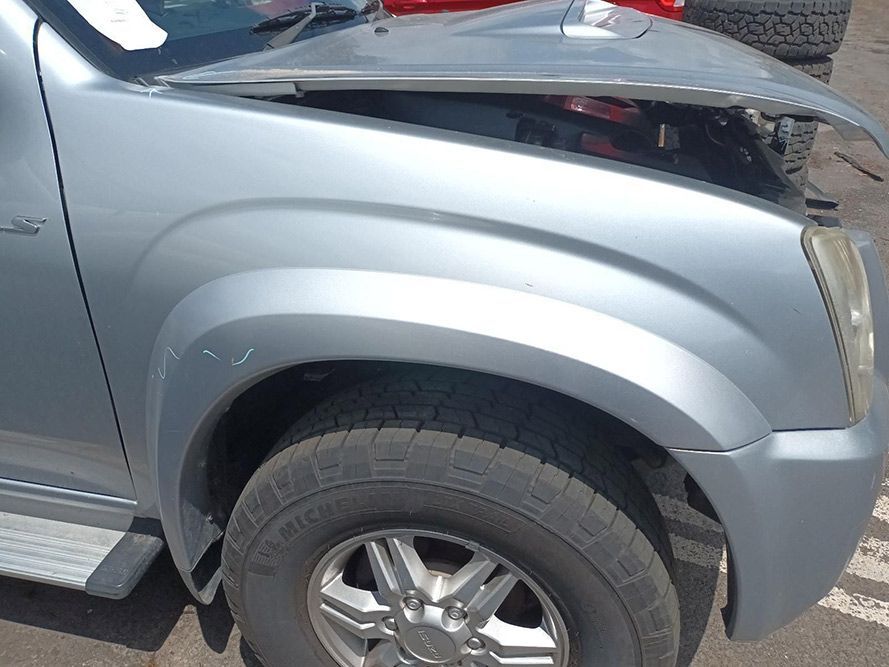 A Silver Truck With the Hood Open is Parked on the Side of the Road — South West 4WD Wreckers In Harristown, QLD