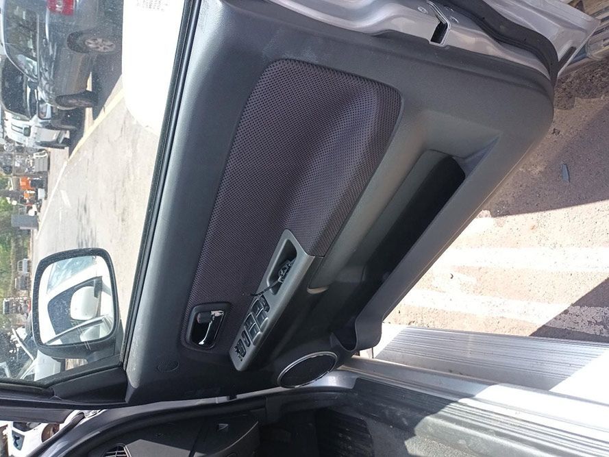 A Car is Parked in a Parking Lot With the Door Open — South West 4WD Wreckers In Harristown, QLD