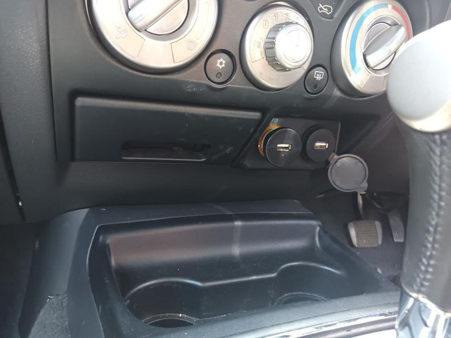A Close Up of the Dashboard of a Car With a Cup Holder — South West 4WD Wreckers In Harristown, QLD