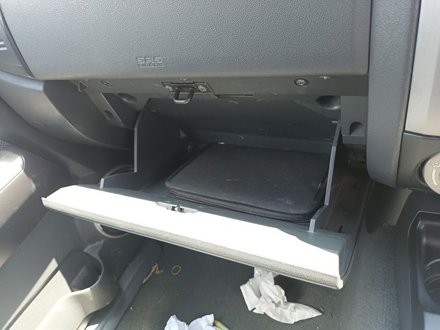 A Glove Box in a Car With a Laptop in It — South West 4WD Wreckers In Harristown, QLD
