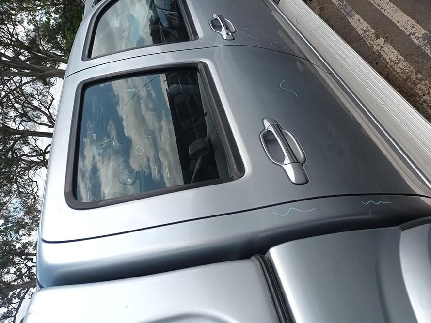 A Close Up of a Silver Car With a Roof Rack on Top of It — South West 4WD Wreckers In Harristown, QLD