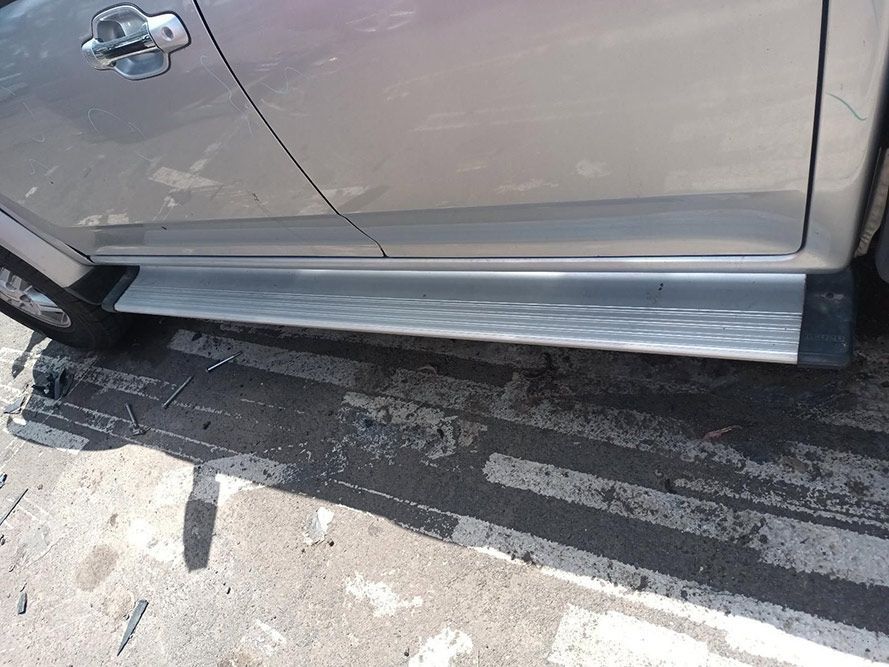 A Silver Car is Parked on the Side of the Road — South West 4WD Wreckers In Harristown, QLD