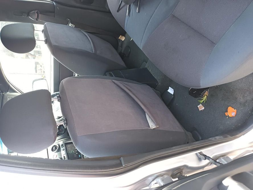 The Inside of a White Car With Black Seats — South West 4WD Wreckers In Harristown, QLD