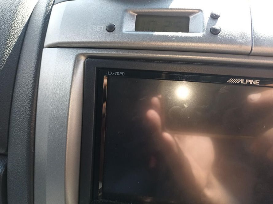A Person is Taking a Picture of Their Reflection in a Alpine Car Stereo — South West 4WD Wreckers In Harristown, QLD