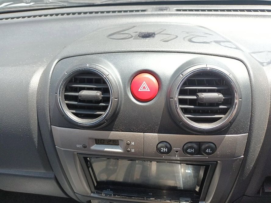 A Close Up of a Car Dashboard With a Red Warning Button — South West 4WD Wreckers In Harristown, QLD