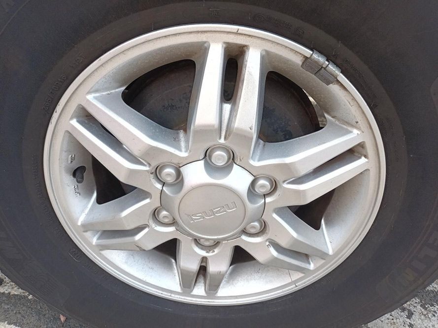A Close Up of a Silver Wheel on a Car — South West 4WD Wreckers In Harristown, QLD