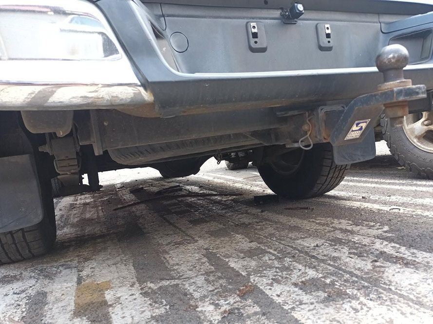 A Black Truck With a Trailer Attached to It is Parked in the Snow — South West 4WD Wreckers In Harristown, QLD