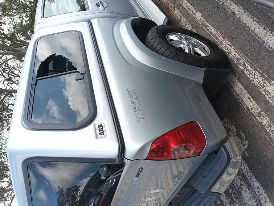 A Silver Truck is Parked on the Side of the Road — South West 4WD Wreckers In Harristown, QLD