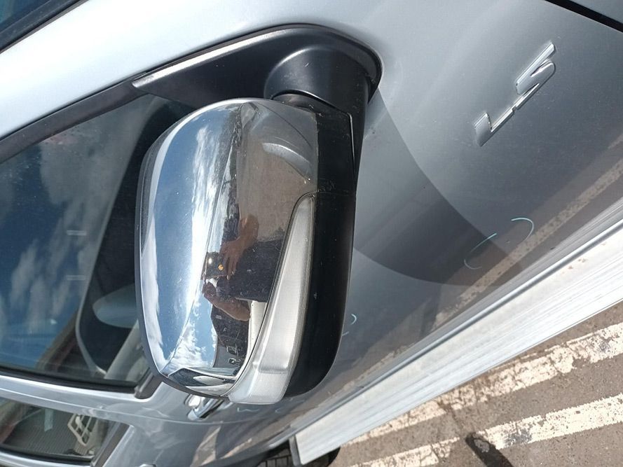 A Silver Car Has a Chrome Side Mirror on It — South West 4WD Wreckers In Harristown, QLD