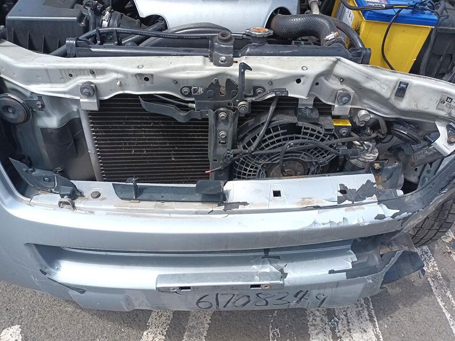 The Hood of a Car is Open and the Radiator is Visible — South West 4WD Wreckers In Harristown, QLD