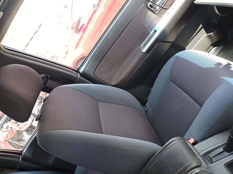 A Close Up of a Car Seat With a Red Truck in the Background — South West 4WD Wreckers In Harristown, QLD