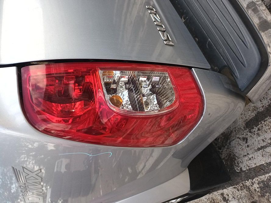 A Close Up of a Silver Car With a Red Tail Light — South West 4WD Wreckers In Harristown, QLD
