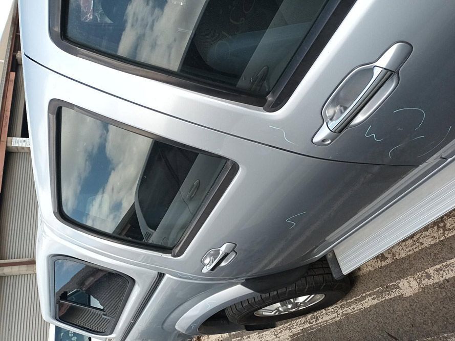 A Silver Car is Parked on the Side of the Road — South West 4WD Wreckers In Harristown, QLD
