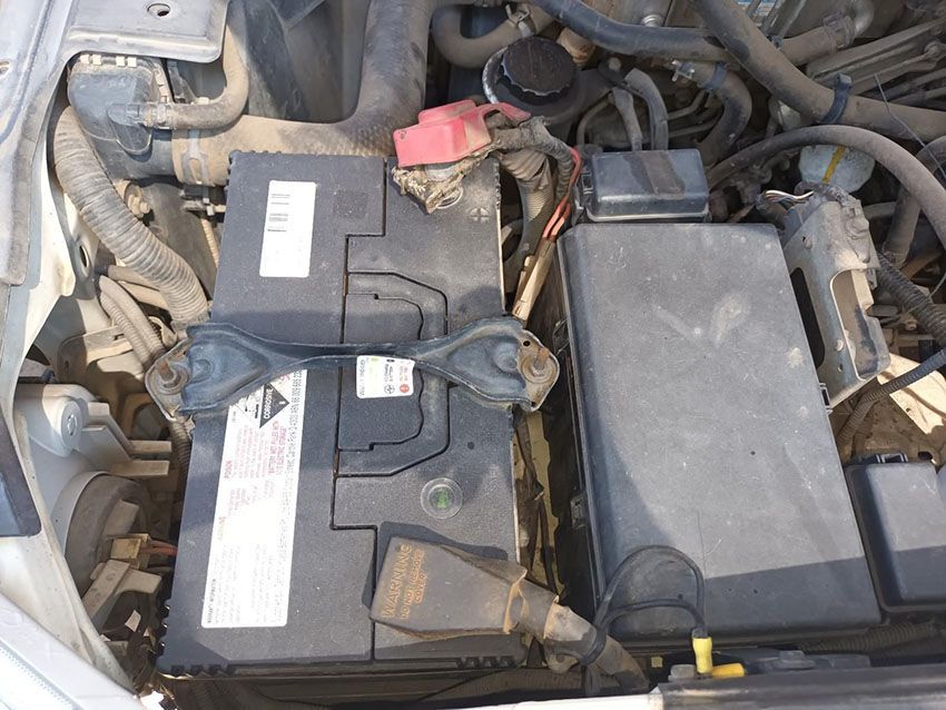 Two Batteries Are Sitting Under the Hood of a Car — South West 4WD Wreckers In Brisbane, QLD