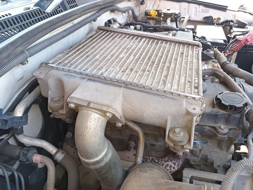 A Close Up of a Car Engine With a Radiator on Top of It — South West 4WD Wreckers In Brisbane, QLD
