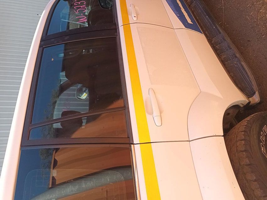 A White Car With a Yellow Stripe on the Door — South West 4WD Wreckers In Brisbane, QLD