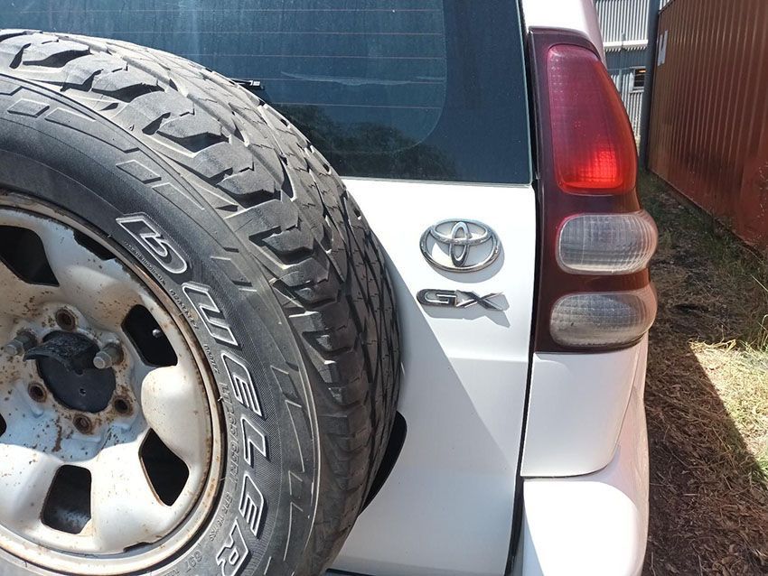 A White Toyota Suv With a Spare Tire on the Back — South West 4WD Wreckers In Brisbane, QLD