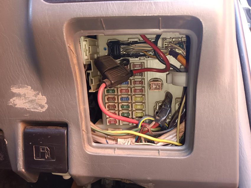 A Close Up of a Fuse Box in a Car With Wires Coming Out of It — South West 4WD Wreckers In Brisbane, QLD