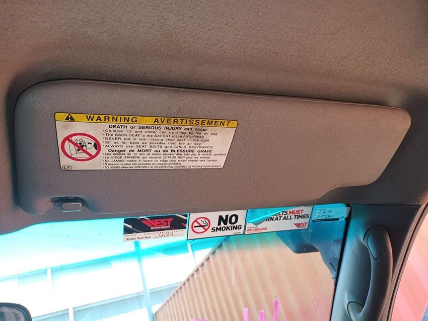 A Sun Visor With a Warning Sign on It — South West 4WD Wreckers In Brisbane, QLD
