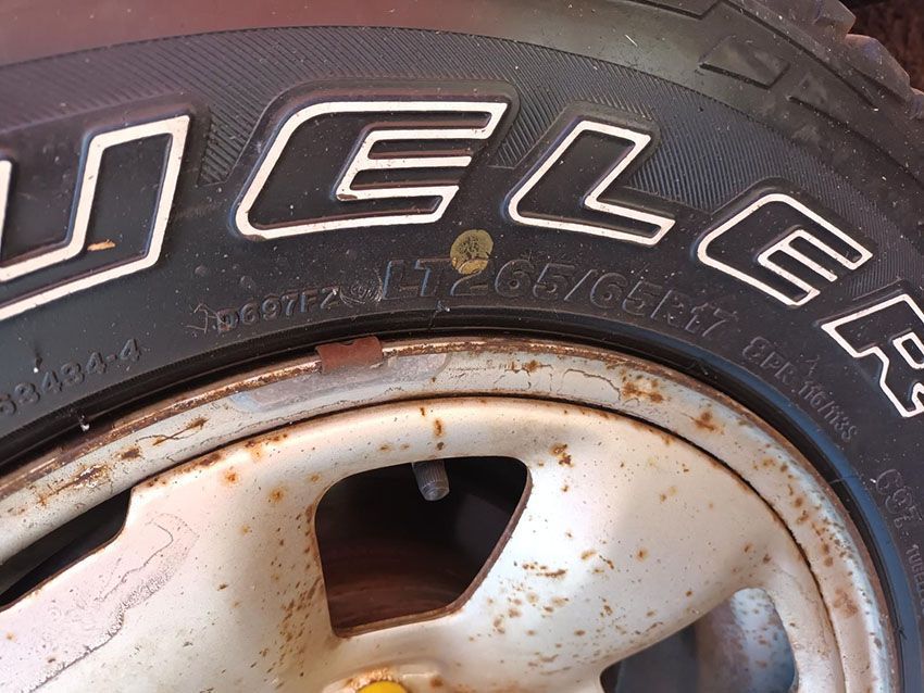 A Close Up of a Michelin Tire on a Rusty Rim— South West 4WD Wreckers In Brisbane, QLD