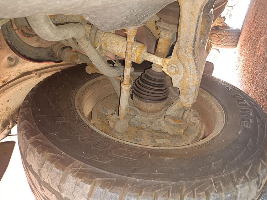 A Close Up of the Underside of a Car With a Tire on It — South West 4WD Wreckers In Brisbane, QLD