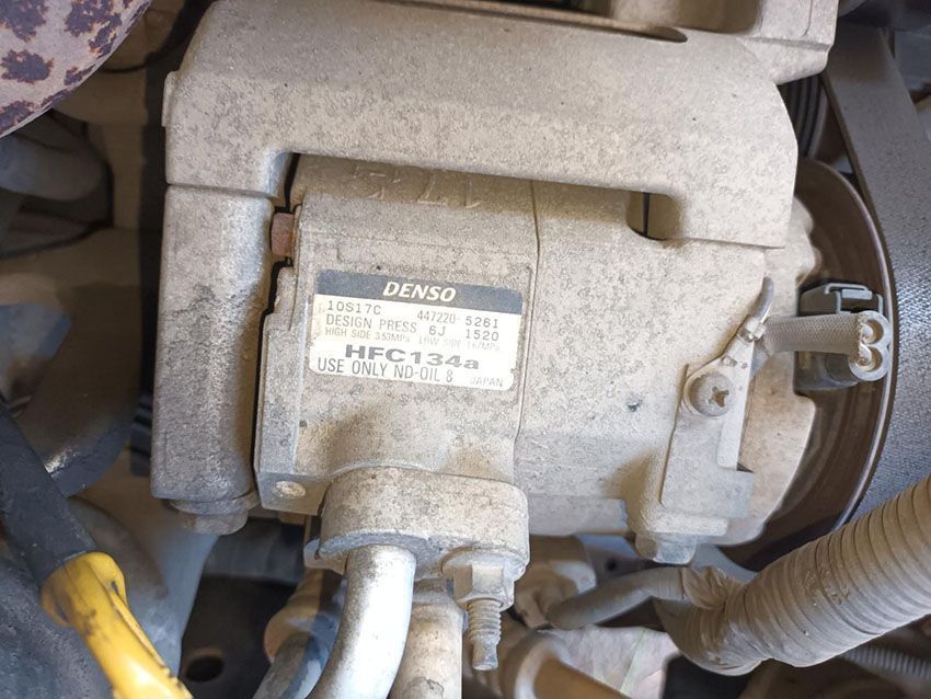 A Close Up of a Denso Air Compressor in a Car — South West 4WD Wreckers In Brisbane, QLD