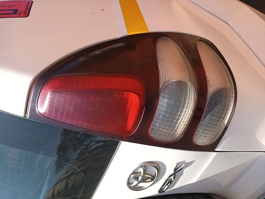 A Close Up of a White Car With a Red Tail Light — South West 4WD Wreckers In Brisbane, QLD